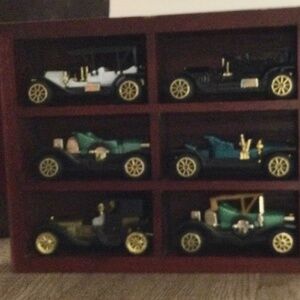 Model vintage style toy cars in wooden box